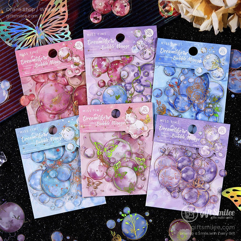 A set of Dreamlike Bubble Mirage stickers in pastel hues featuring bubble and butterfly designs, displayed on a glittery black surface