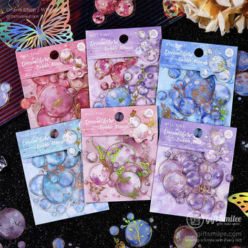 A set of Dreamlike Bubble Mirage stickers in pastel hues featuring bubble and butterfly designs, displayed on a glittery black surface