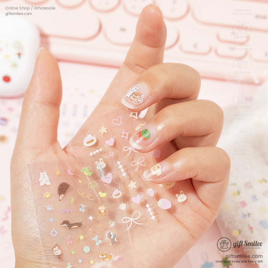 A hand showcasing kawaii stickers applied to nails, highlighting their delicate and versatile design