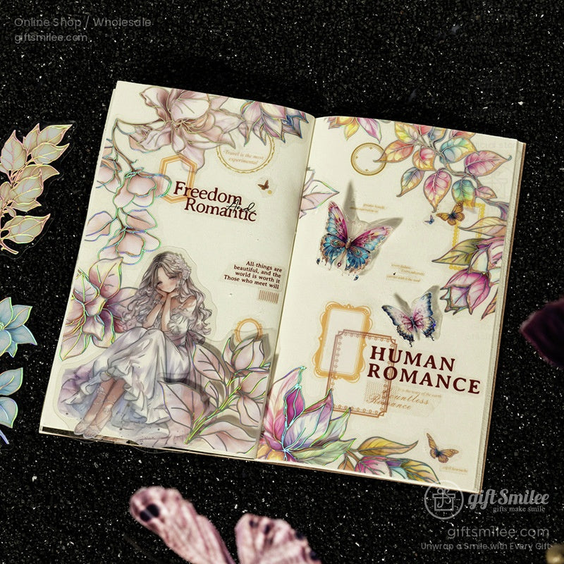 Artistic scrapbook page decorated with holographic floral decals, butterflies, and romantic accents