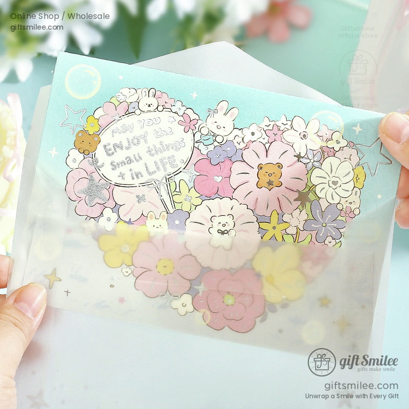 Pastel floralthemed card with cute animal illustrations soft pink and yellow blooms and uplifting handwritten text