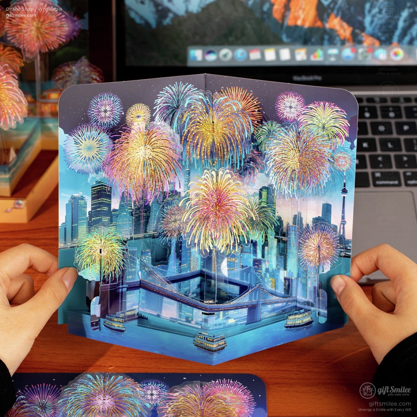 Multicolor 3D popup card of a nighttime cityscape with vibrant fireworks illuminated skyline and bridge over water