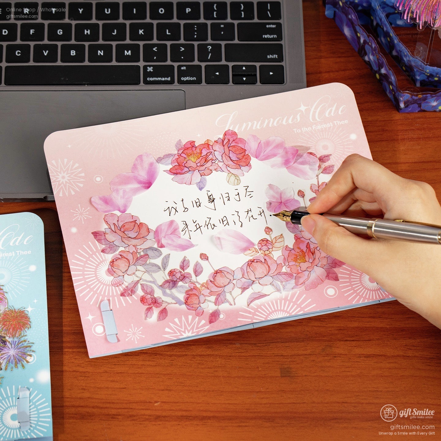 Pink floral notebook with watercolor rose design rounded edges decorative patterns and handwritten text in pen