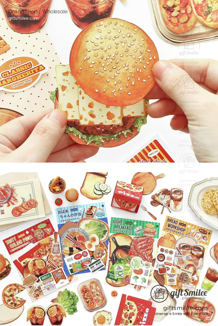 Food-themed scrapbook stickers with bread, desserts, and drinks laid out around an open journal  