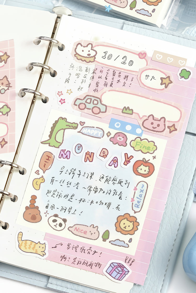 Pastel pink planner page with colorful animal stickers doodles handwritten text and a ring binder design