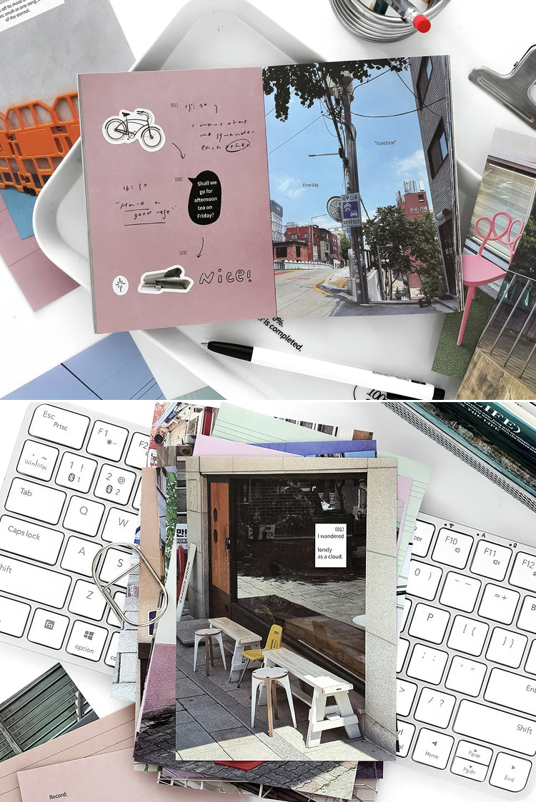 Open scrapbook with urban street photos pastel pink cover handwritten notes stickers and scattered stationery