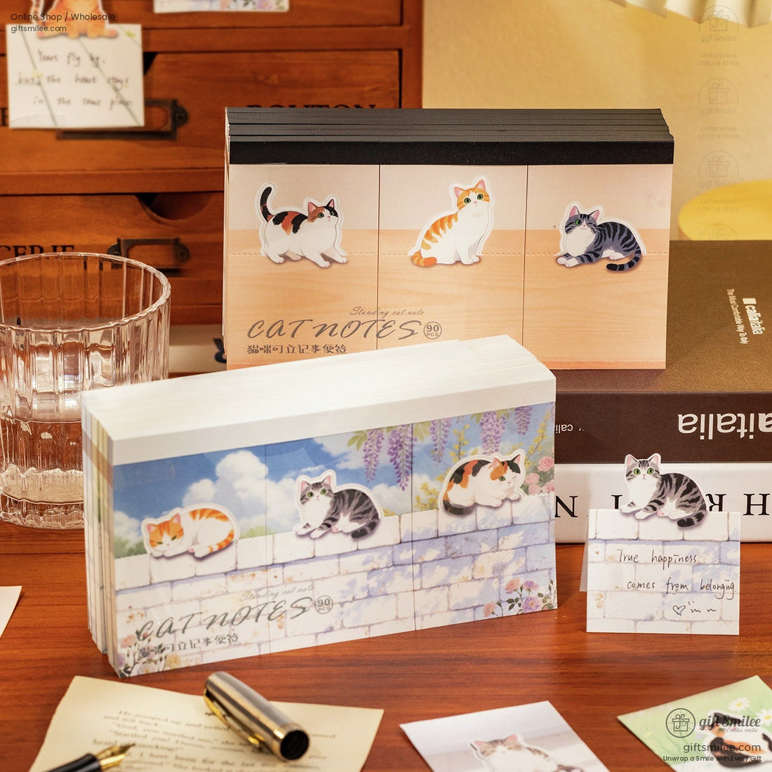 Decorative catthemed sticky notes in pastel designs featuring playful kittens against wood and floral backgrounds