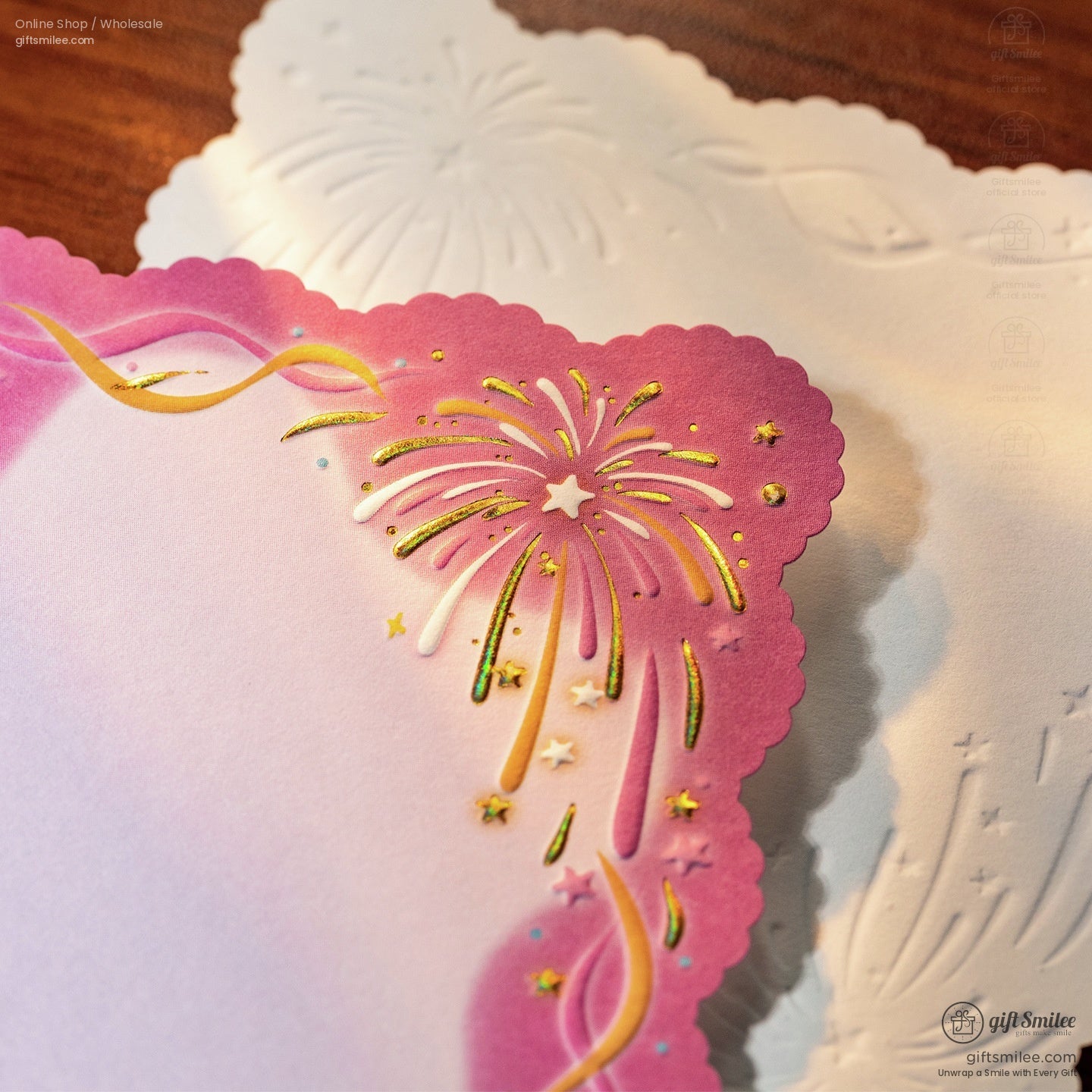 Pink scalloped stationery with goldfoil fireworks design white embossed background and elegant star accents