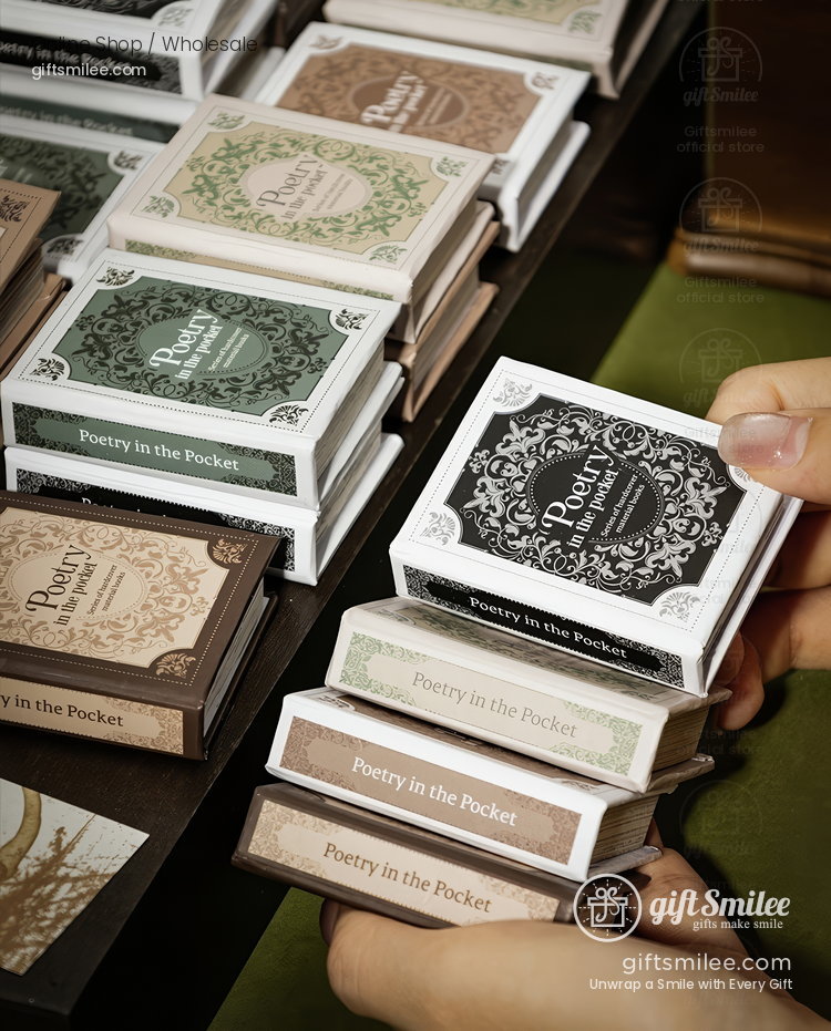 Compact pocketsized books with ornate covers in green black and beige titled Poetry in the Pocket on display