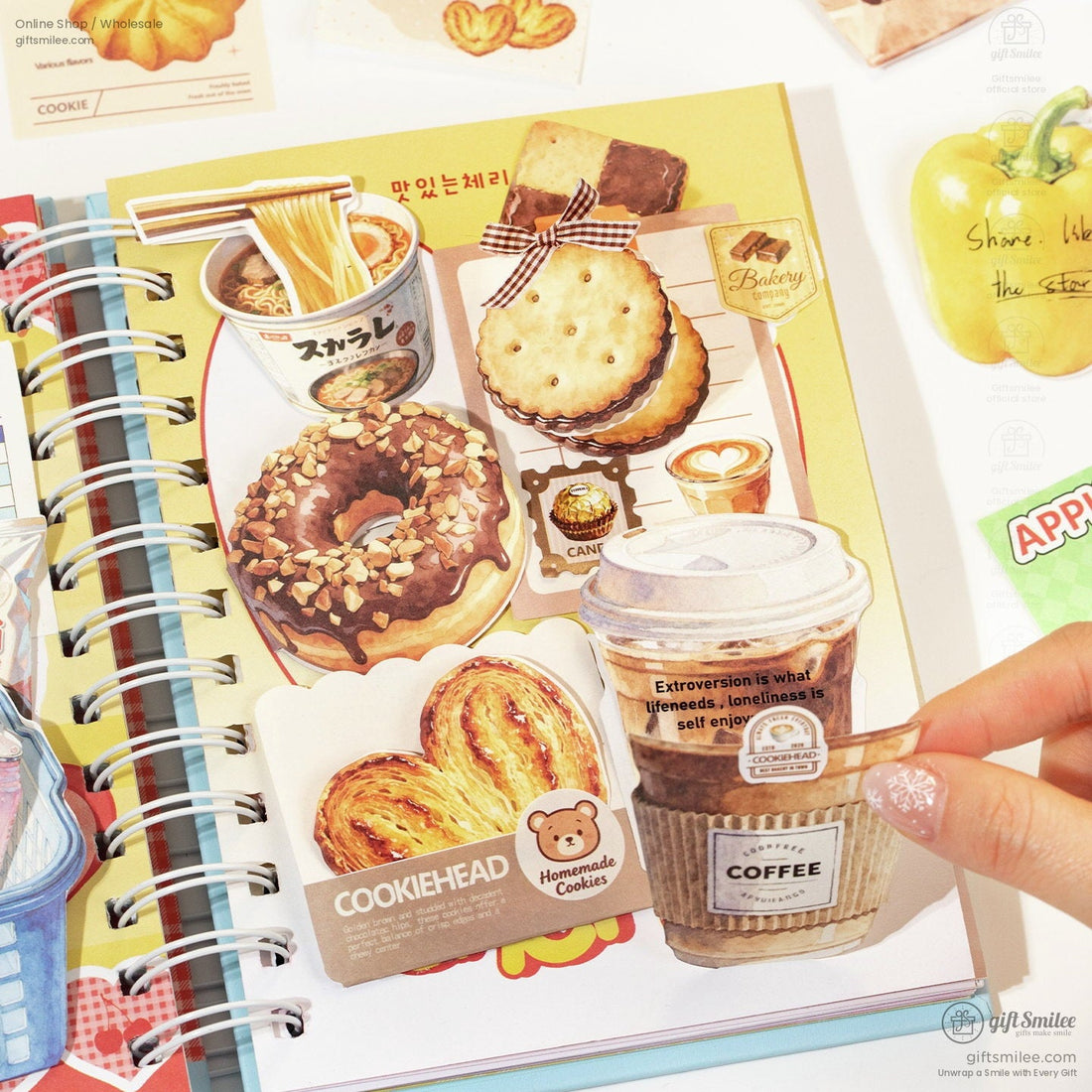 Whimsical foodthemed stickers including a chocolate donut croissant coffee cup and biscuits on a spiral notebook
