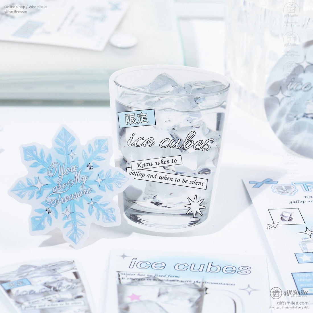 Frosted glass stickers with ice cube illustrations pastel blue accents snowflake designs and minimalist text elements