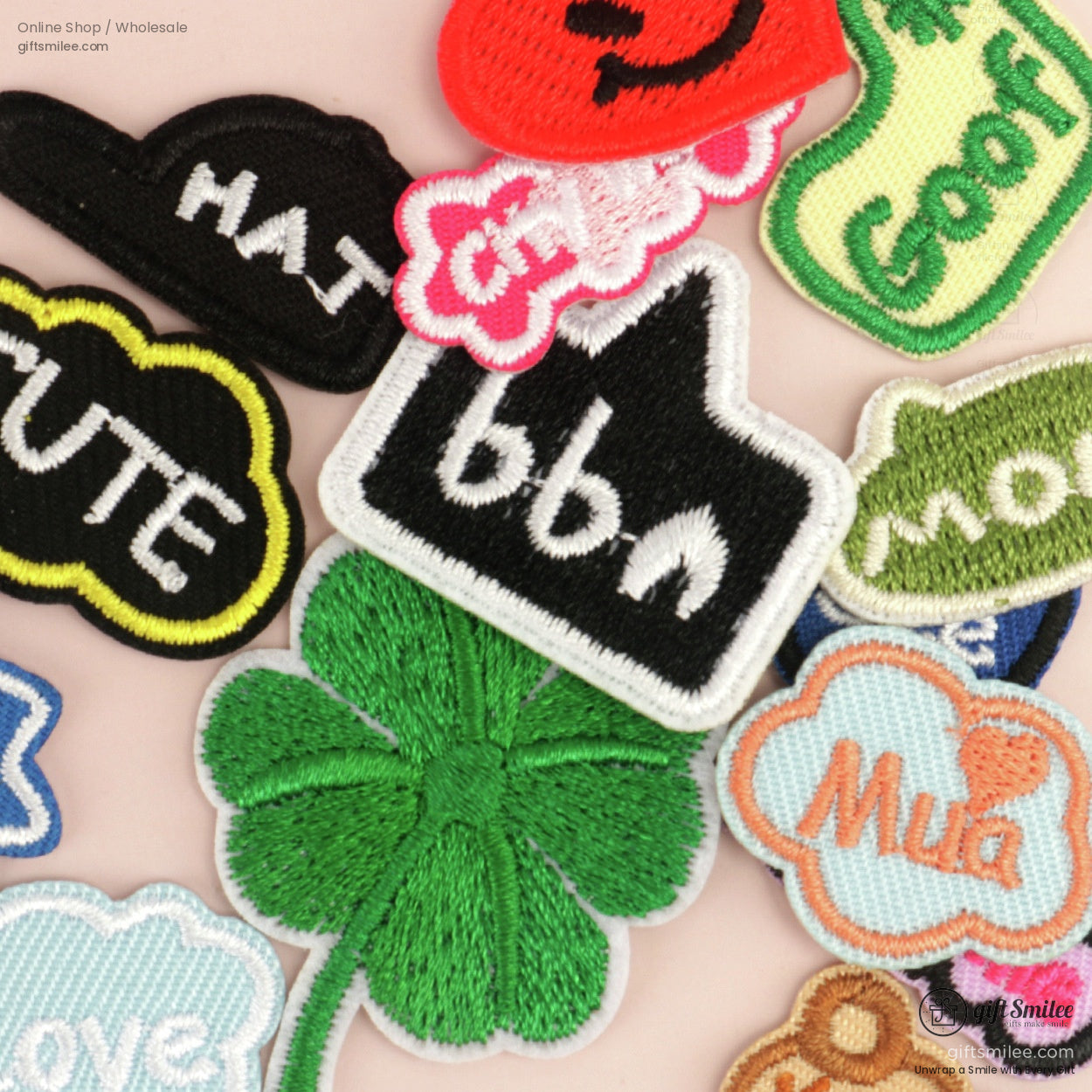 Assorted colorful embroidered patches including a green fourleaf clover vibrant text designs and playful shapes