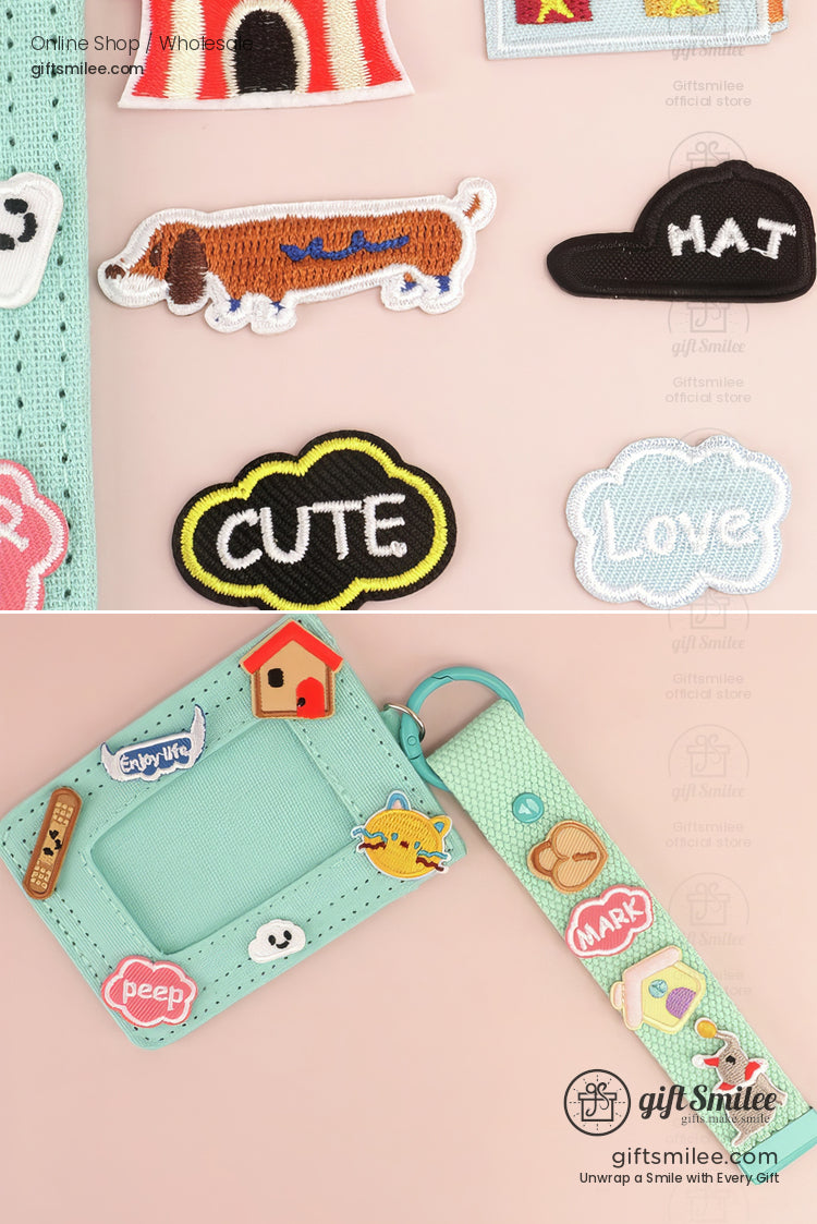 Mint green fabric lanyard and ID holder with colorful embroidered patches including a dachshund birdhouse and text designs