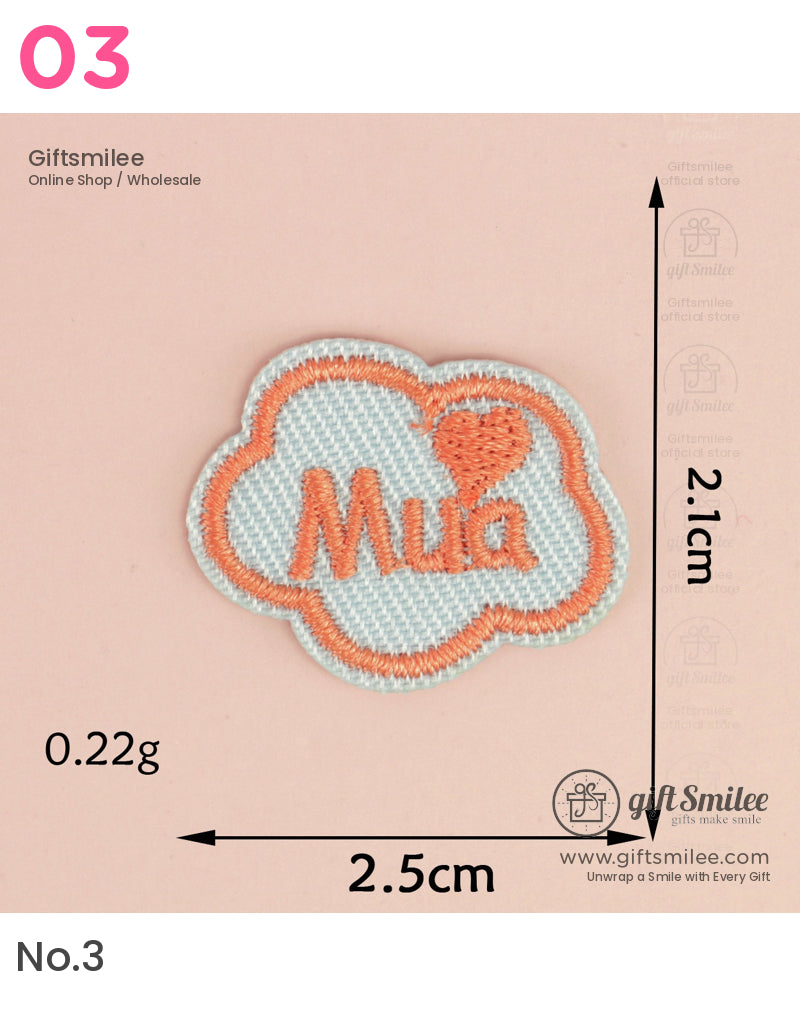 Light blue embroidered patch in cloud shape with orange Mua text and heart detail measuring 25cm by 21cm