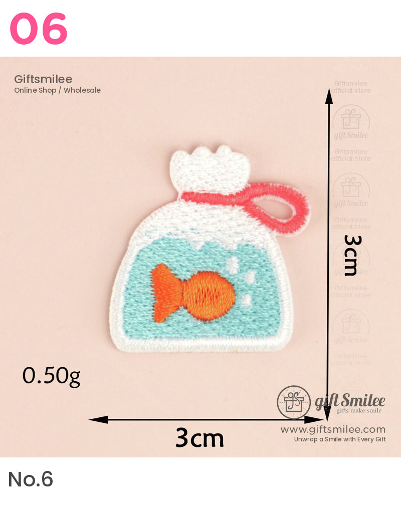 Orange fish embroidery patch in a turquoise water bag with red ribbon white border 3x3 cm lightweight fabric design