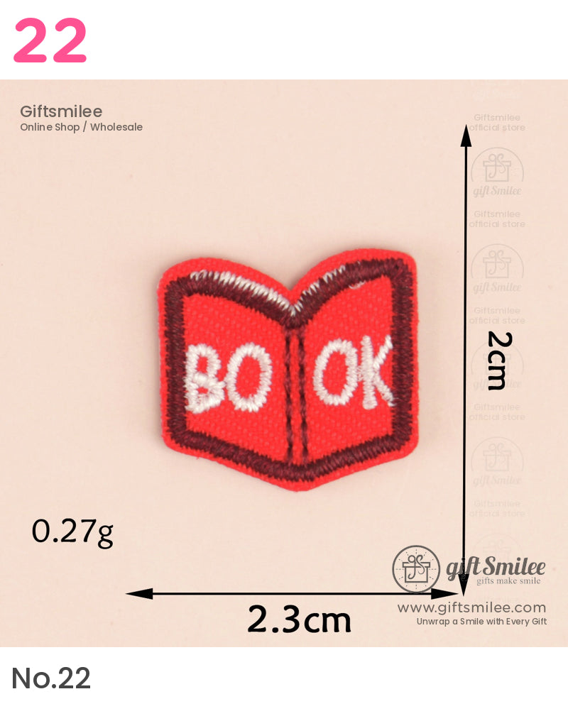 Red embroidered patch shaped like an open book with white text BOOK outlined in brown measuring 23cm x 2cm