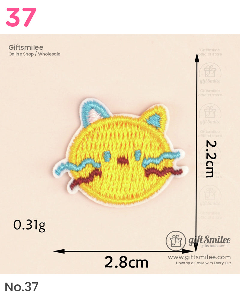 Small yellow embroidered patch of a cat face with blue accents and brown details 28cm wide and 22cm tall