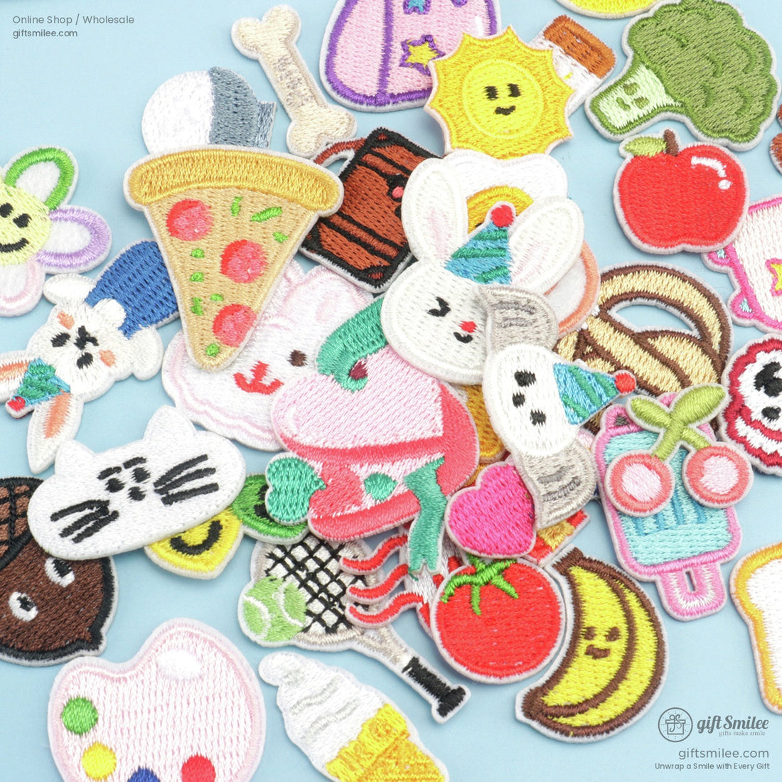 Colorful embroidered ironon patches featuring food animals and objects on a light blue background