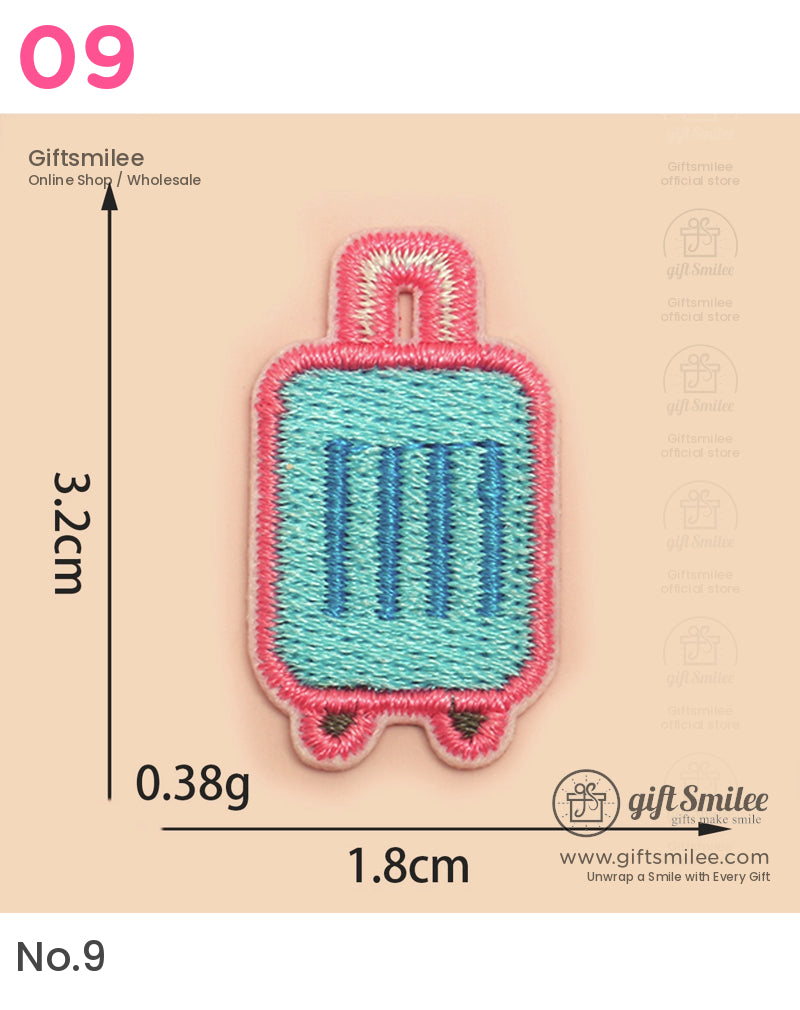 Rectangular embroidered luggage patch in turquoise with pink border blue stripes and handle detail 32cm tall