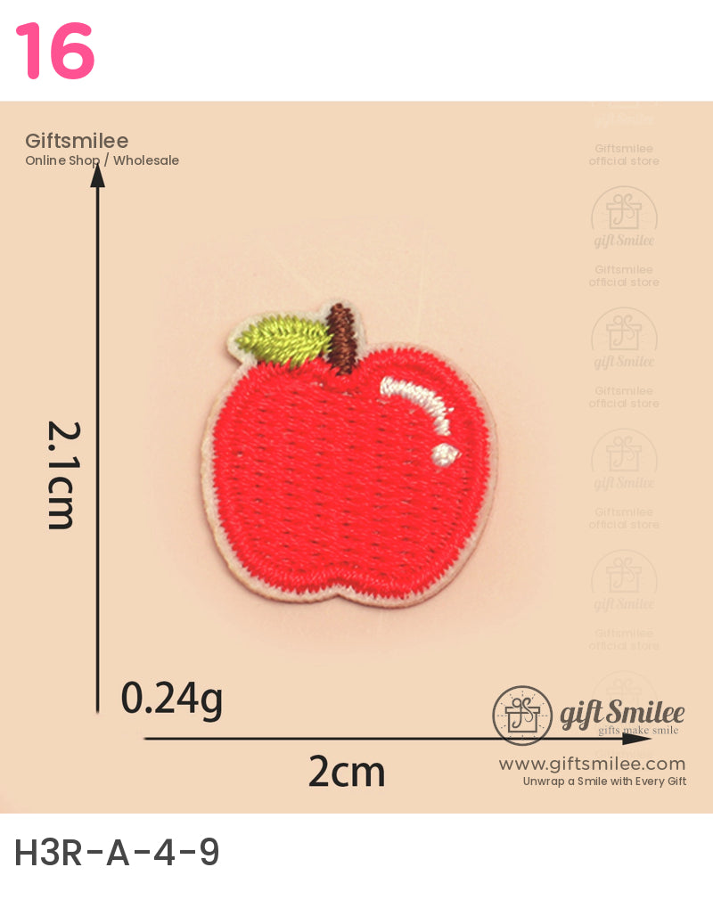 Red embroidered apple patch with green leaf brown stem and beige border measuring 2cm by 21cm