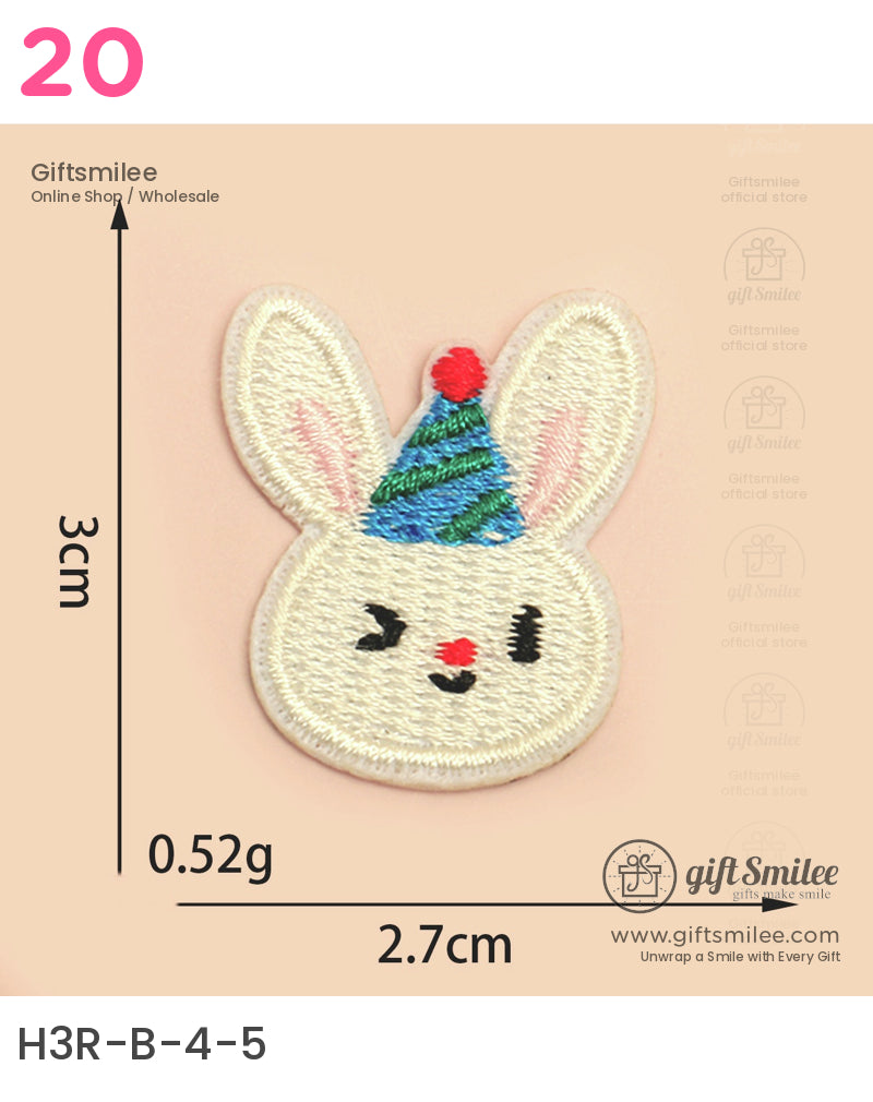 White embroidered bunny patch with pink ears a green and blue striped party hat and red nose measuring 3x27cm