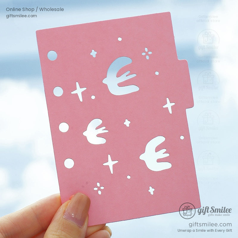 Packaged laser-cut pastel pink and green divider inserts with bird designs