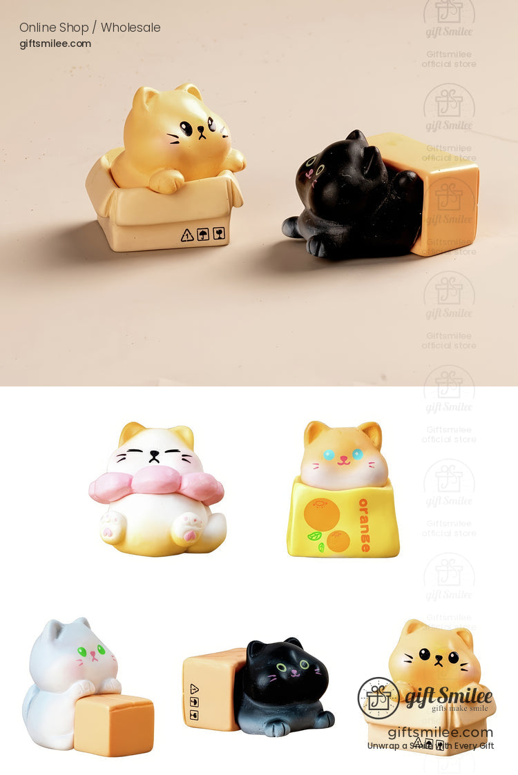 Cute cat figurines in pastel tones with playful box designs featuring orange black white and gray color variations