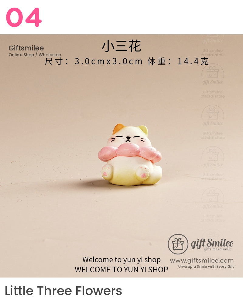 Small yellow and white ceramic cat figurine with orange ear and pink flower collar 3cm size minimalist design