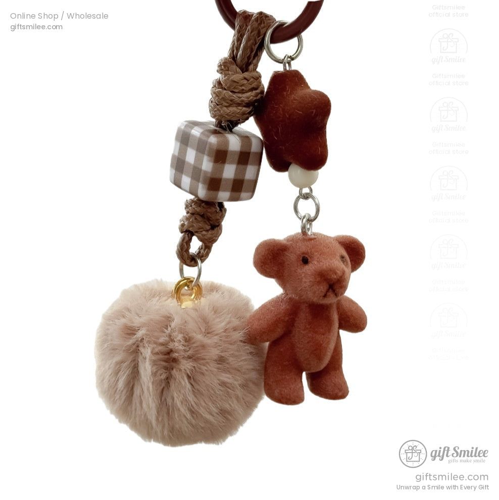 Brown teddy bear keychain with tan faux fur pompom braided rope plaid cube bead and star charm accents