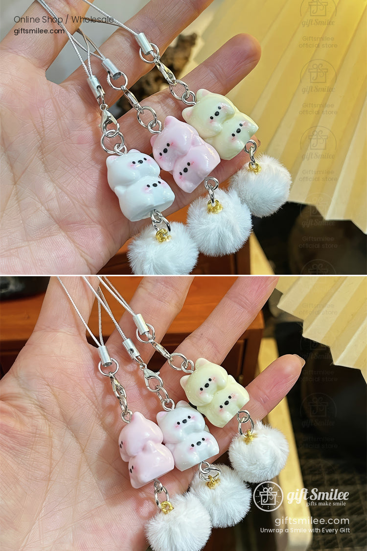 Pastel bearshaped resin charms in pink white and cream with fluffy white pompoms and silver keychain loops