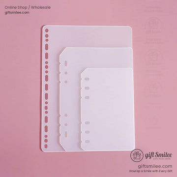 Transparent frosted plastic binder dividers in three sizes with prepunched holes on a pink background