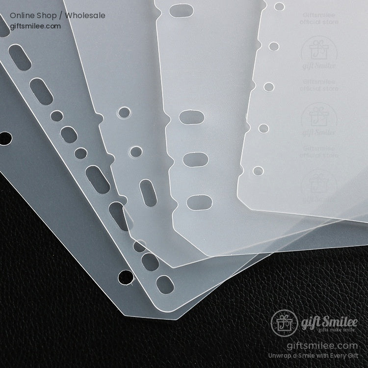 Transparent plastic binder dividers with prepunched holes frosted finish and durable edges on black surface