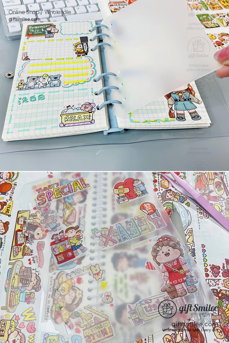 Pastel blue ringbound planner with colorful cartoon stickers grid pages and protective transparent inserts