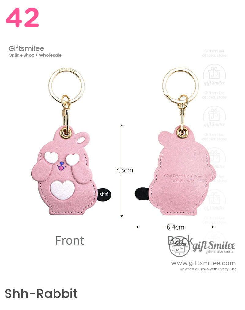 Pink bearshaped faux leather keychain with heart details gold metal ring playful design and shh accent