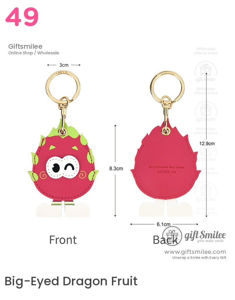 Pink dragon fruitshaped leather keychain with green leaf details winking cartoon face gold metal ring and dimensions