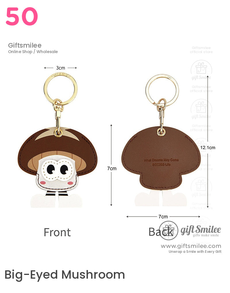 Brown mushroomshaped faux leather keychain with cartoon eyes gold metal ring and engraved text on the back