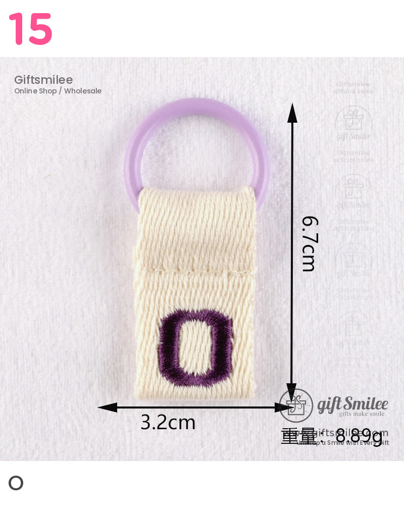 Beige woven fabric tab with a purple embroidered O and lilac plastic ring measuring 67x32 cm weight 889g