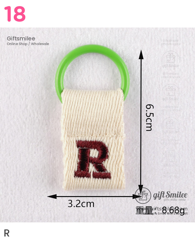 Cream woven fabric keychain with red embroidered R and green plastic ring dimensions 65cm x 32cm weight 868g