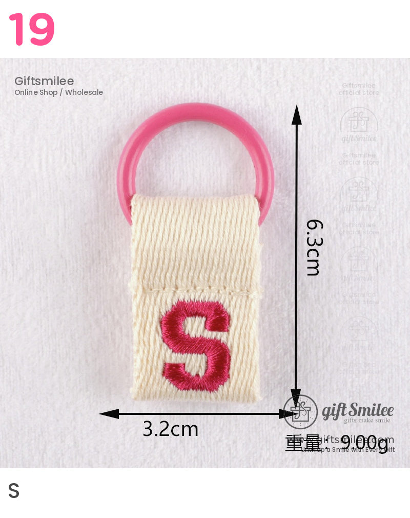Cream canvas keychain with embroidered pink S and round pink plastic ring measuring 63cm by 32cm 9g weight