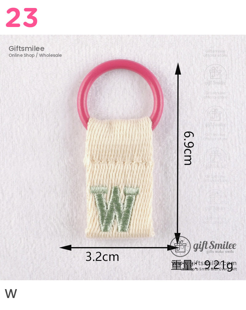 Cream cotton fabric keychain with pink ring green embroidered W and compact 69cm by 32cm size