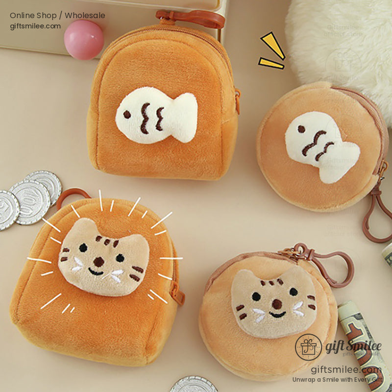 Set of orange plush coin purses with cat and fish appliqus soft texture zip closures and keychain clips