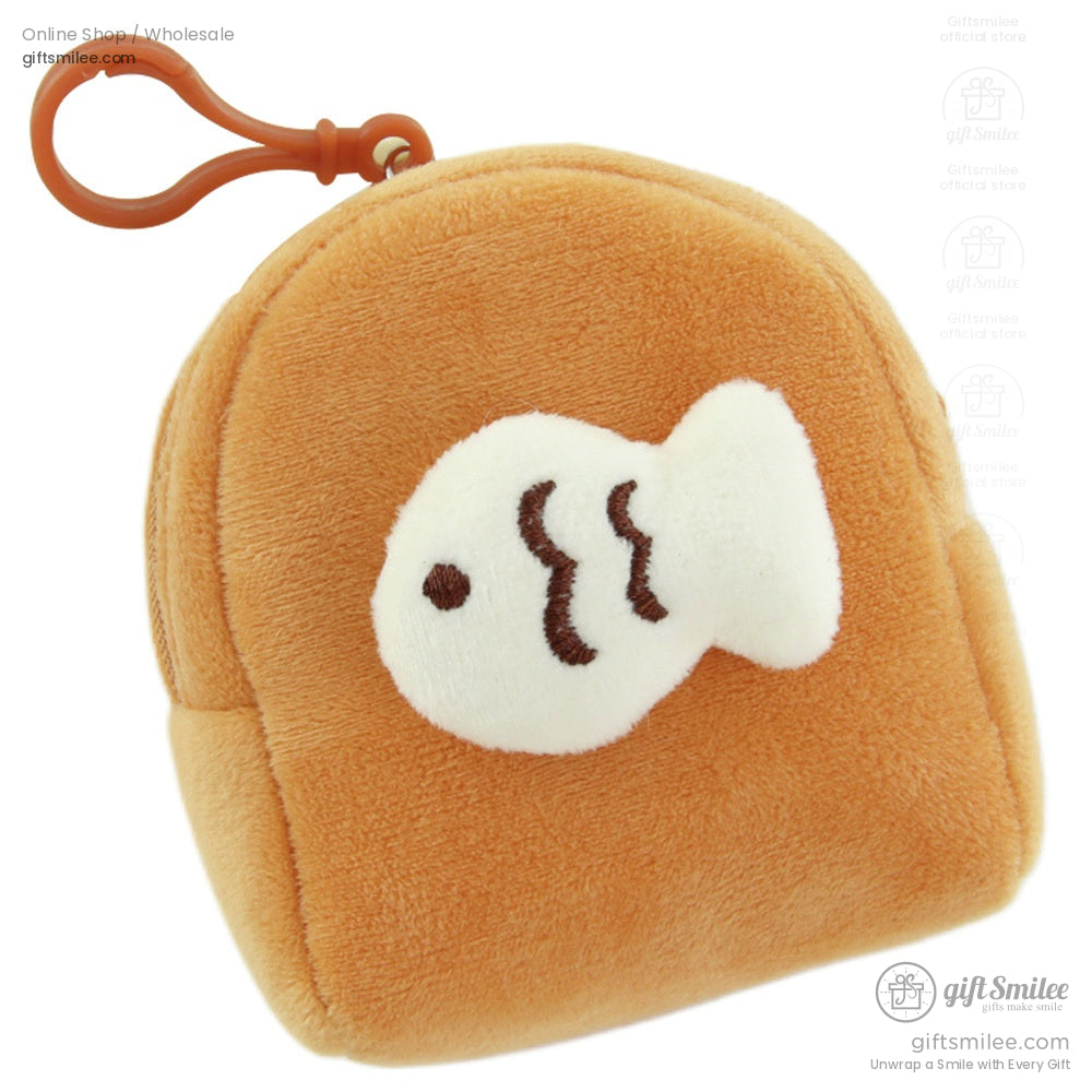 Soft orange plush pouch with white fish applique brown embroidered details and orange clip for attachment