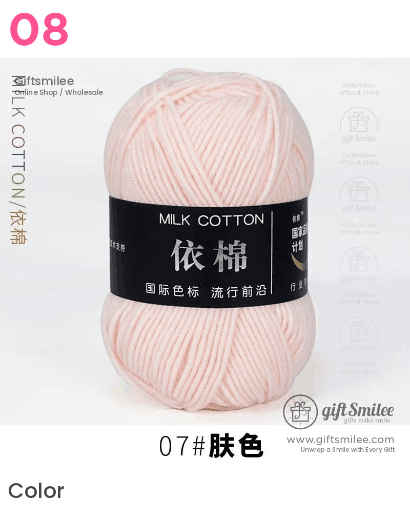 Soft pale pink milk cotton yarn with a smooth texture labeled in black packaging ideal for knitting or crochet
