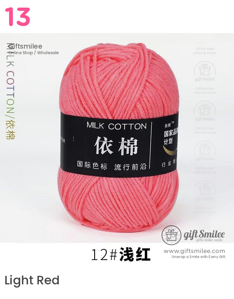 Soft pink milk cotton yarn skein smooth texture with a black label perfect for knitting or crocheting projects