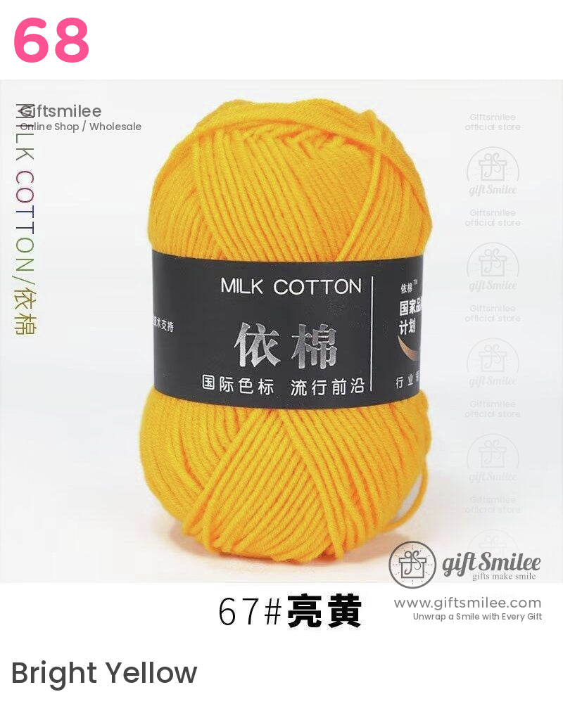 Bright yellow milk cotton yarn ball with soft smooth texture and a black label for versatile knitting projects