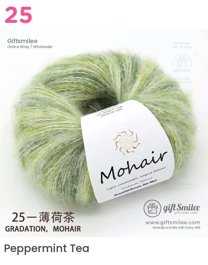 Soft green gradient mohair yarn skein with fluffy texture and white branded label for knitting and crochet projects