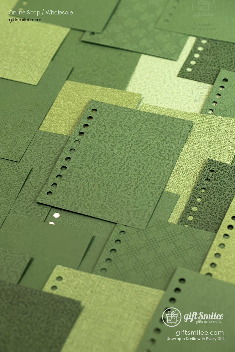 Green textured planner refill paper samples with 6-hole punched edges arranged in a flat lay for notebooks and binders.