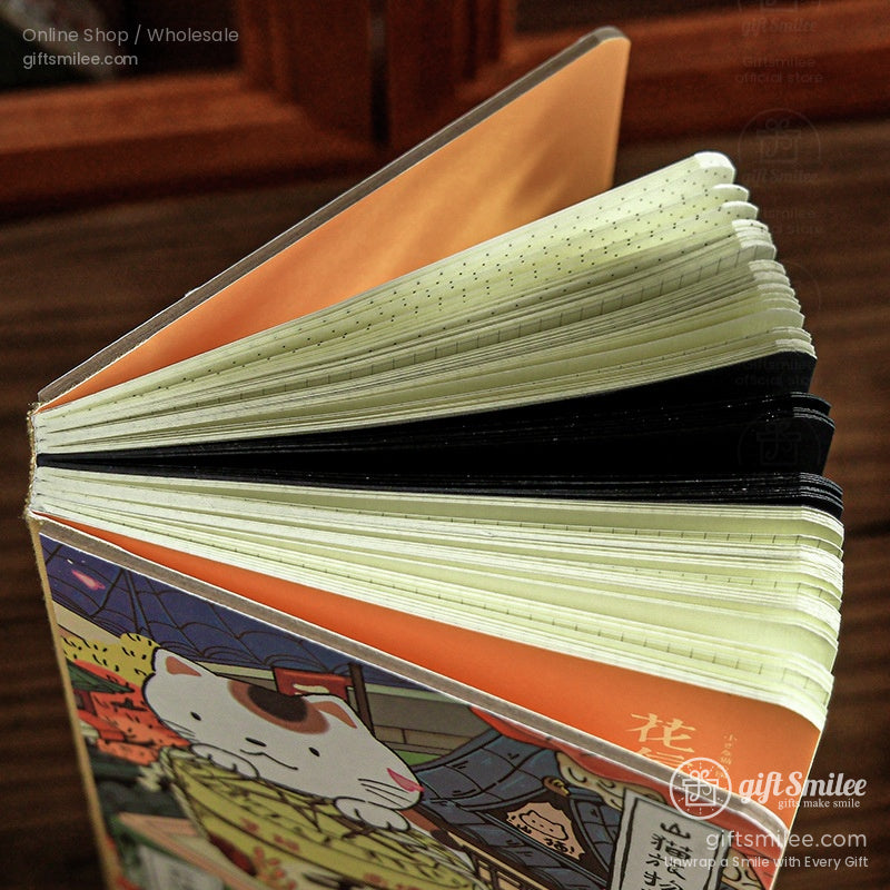 Hardcover notebook with cat illustration orange inner cover cream dotted pages and black tabbed dividers