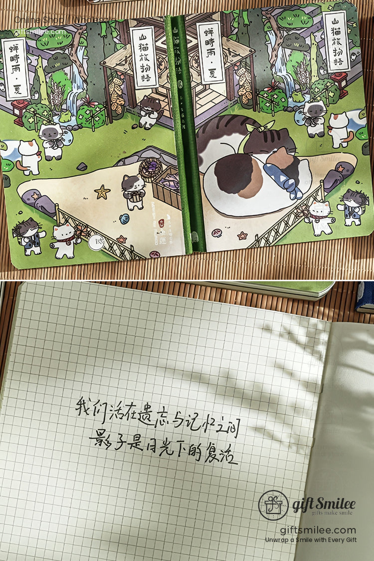 Illustrated green notebook with cartoon cats lounging in a garden and open grid paper featuring handwritten text