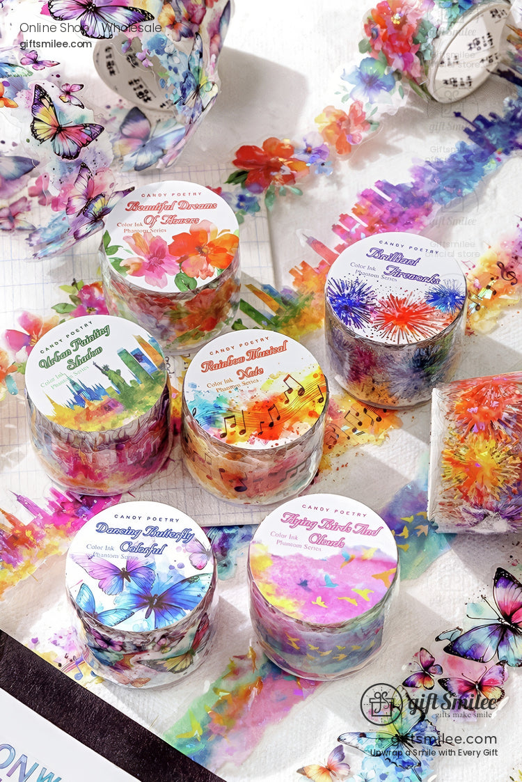 Colorful floral and butterfly-themed washi tape rolls arranged on a desk for scrapbooking and crafts